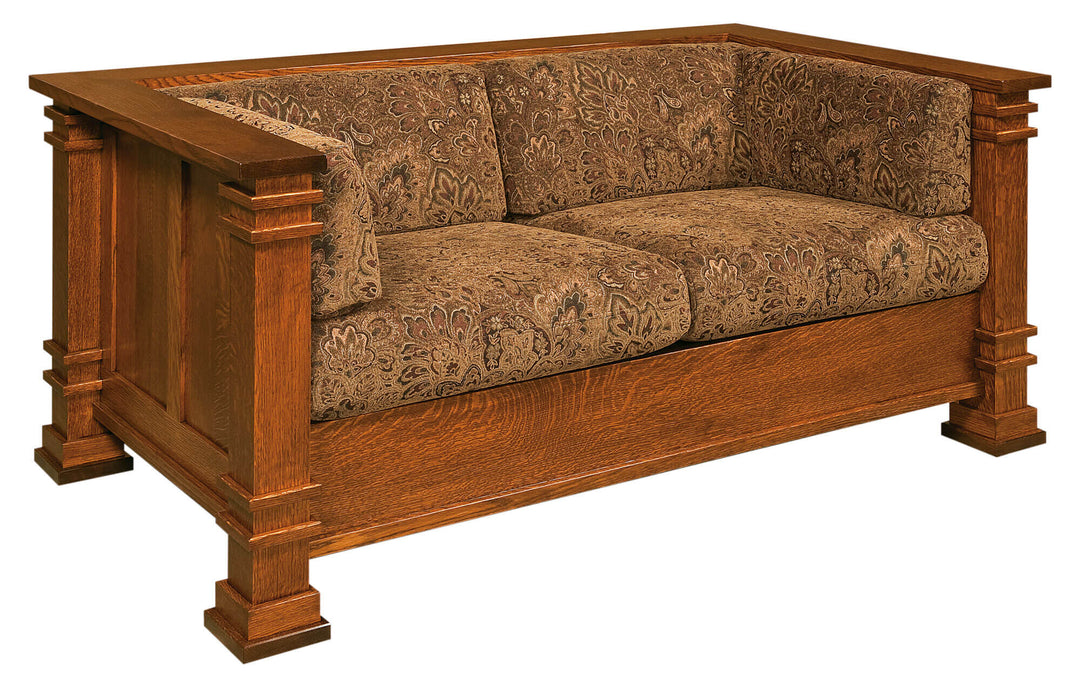 Wooden sofa with patterned cushions on a white background