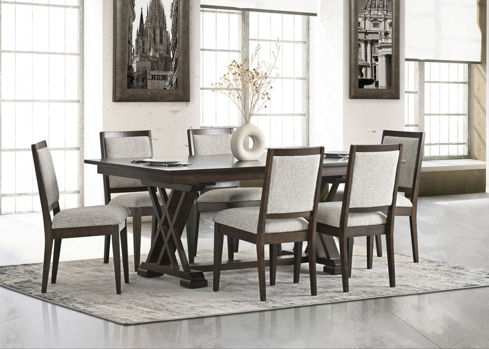 Dining room with a wooden table and chairs in a well-lit room.
