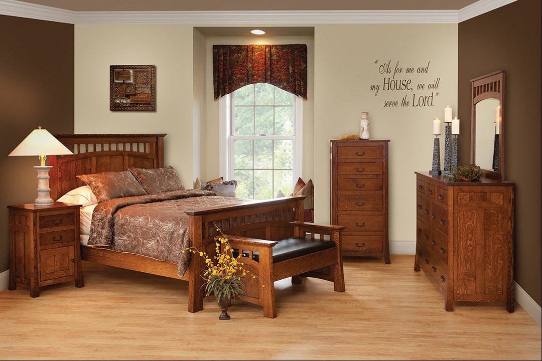 Wooden bedroom furniture set including bed, dresser, and nightstands in a room with a window.